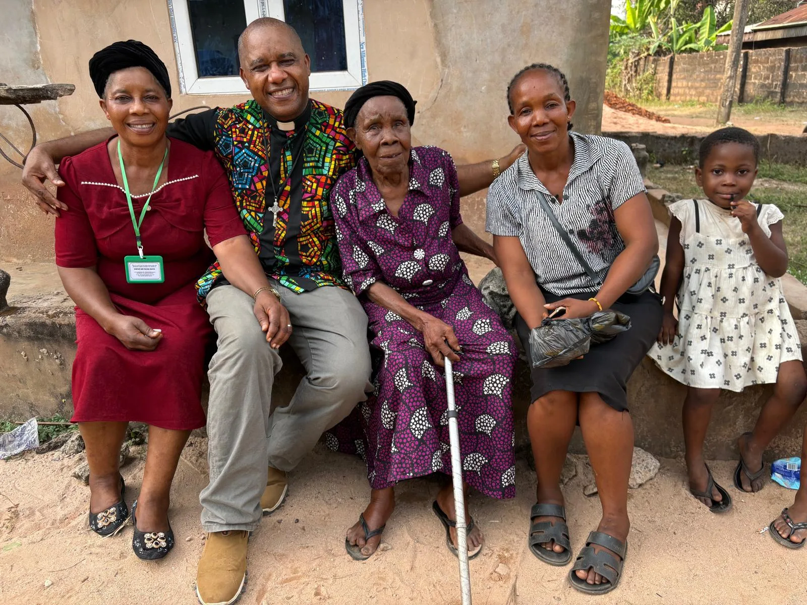 Hospital staff visiting and sitting with older members of the community