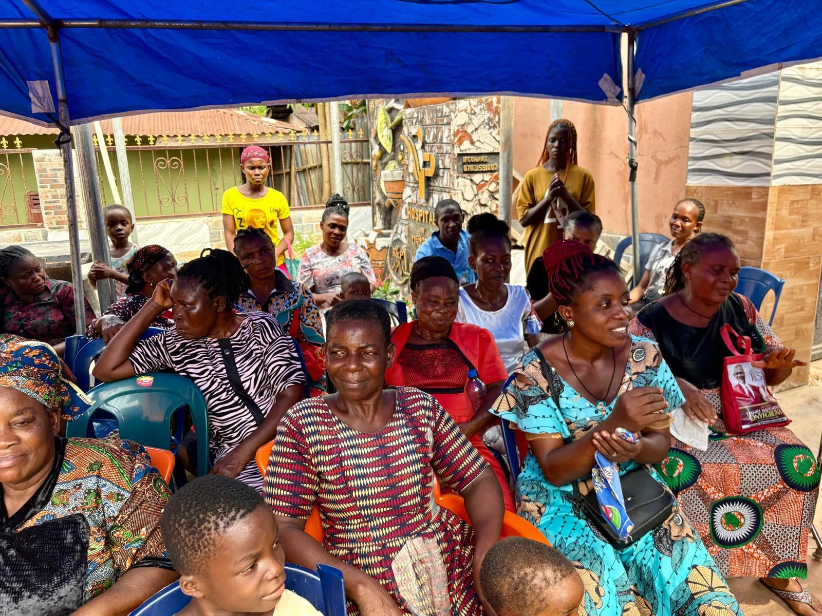 Community members waiting to be seen at a medical outreach clinic